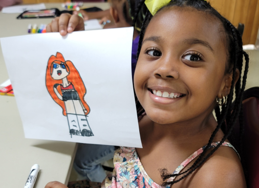 Girls shows picture she drew